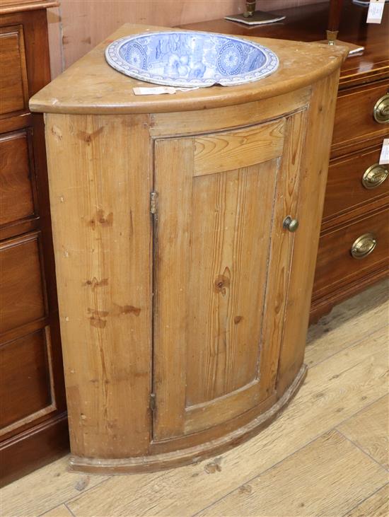 A pine bowfront washstand W.70cm